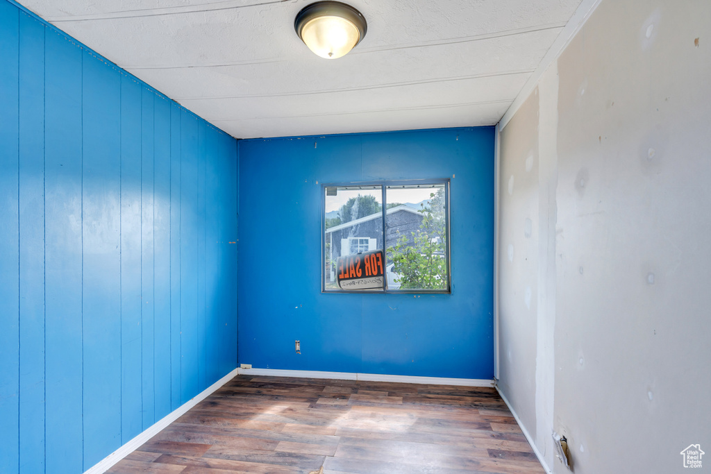 Empty room with wood-type flooring