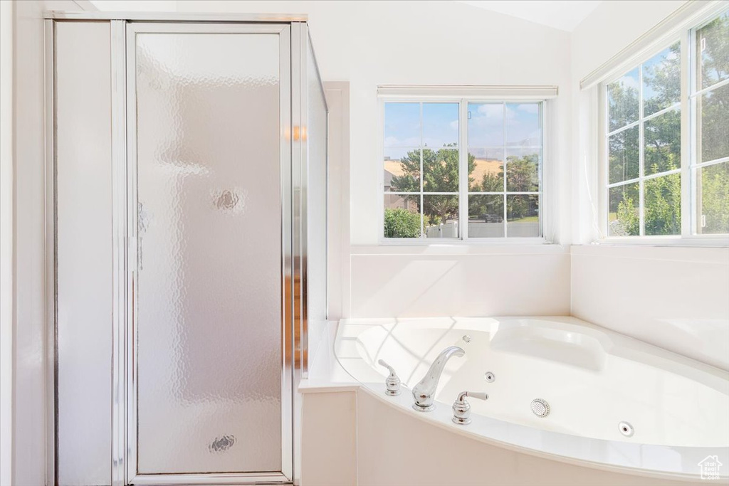 Bathroom with a wealth of natural light and an enclosed shower