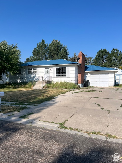 View of front of home featuring a garage