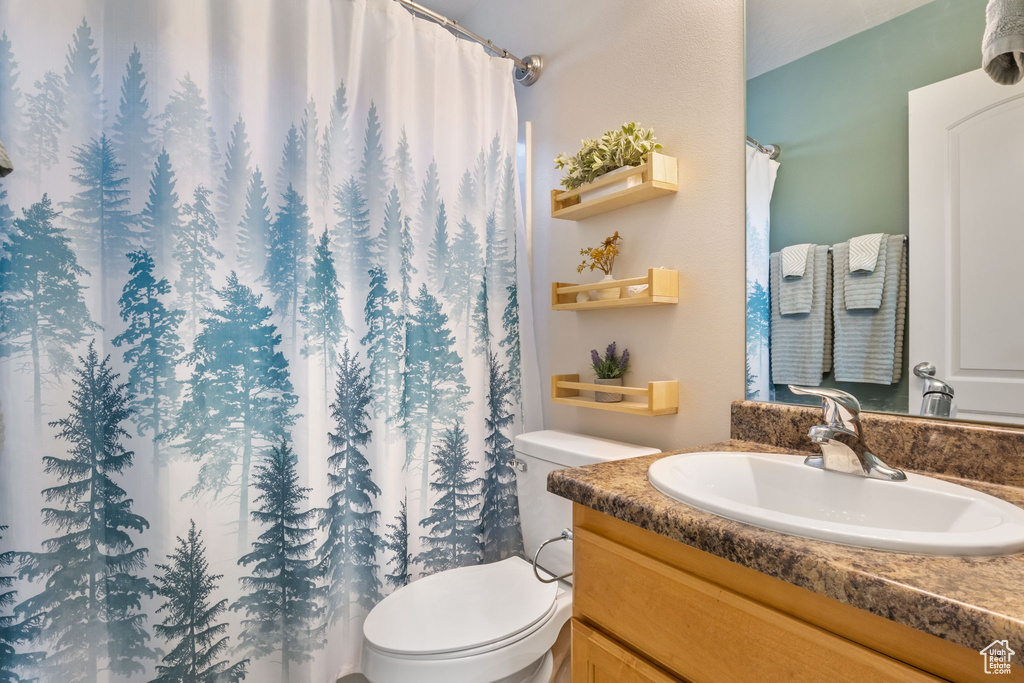 Bathroom with vanity and toilet