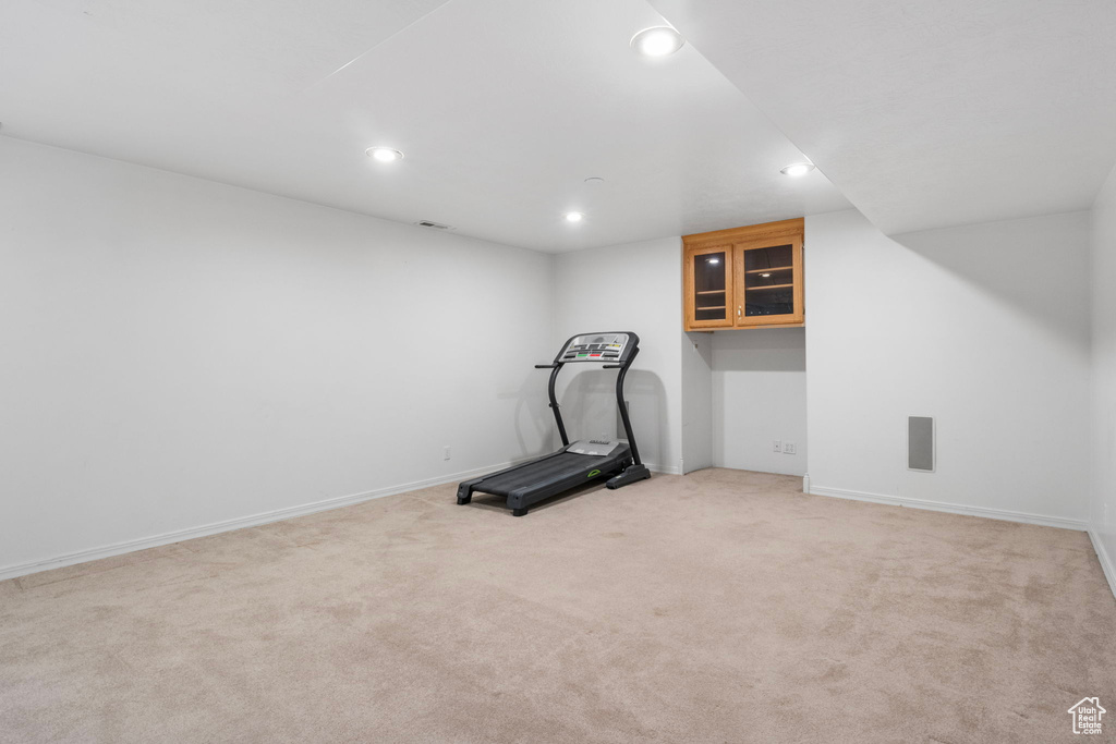 Exercise area with light colored carpet