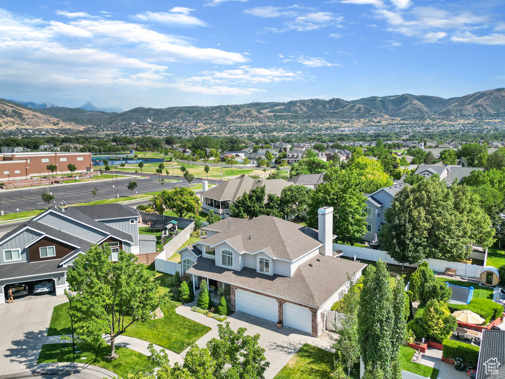 Birds eye view of property with a mountain view