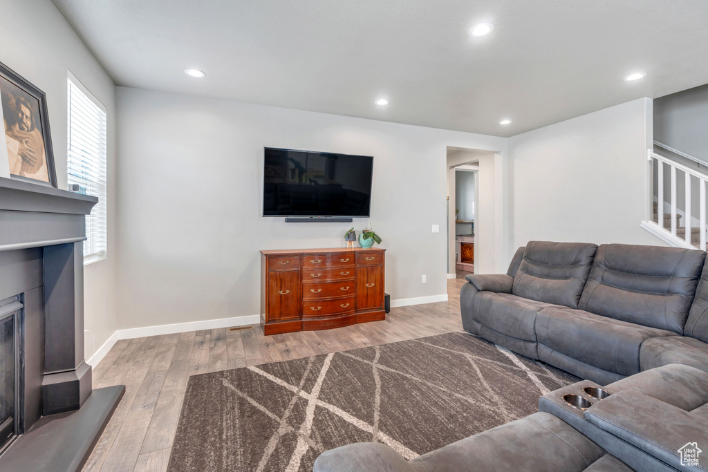 Living room with light hardwood / wood-style floors