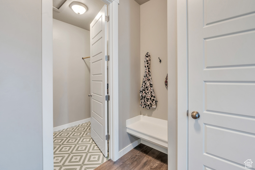 Mudroom with tile patterned floors