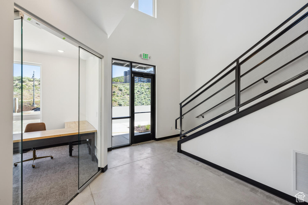 Foyer entrance with a high ceiling