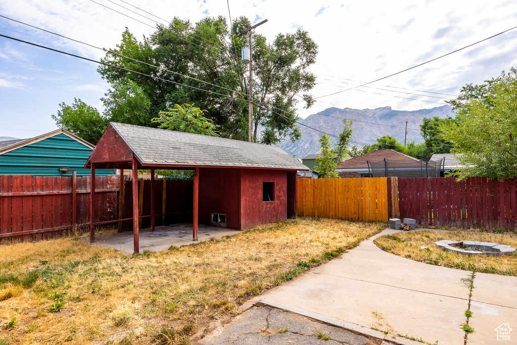 View of yard with a patio and a mountain view