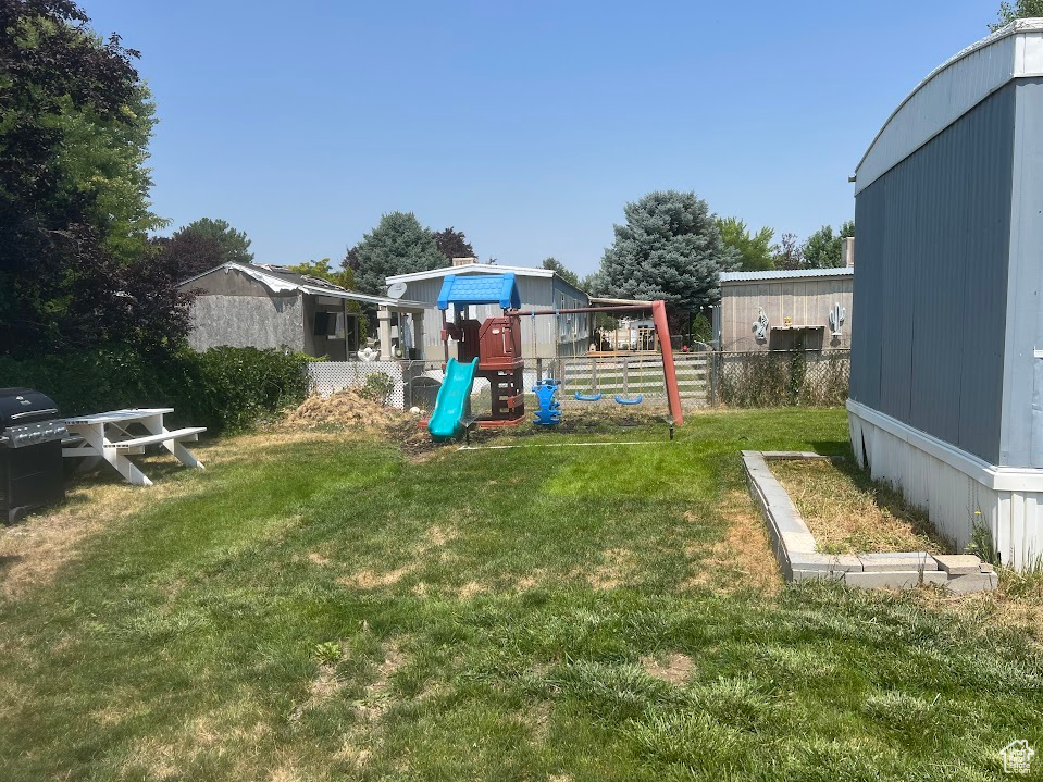 View of yard featuring a playground