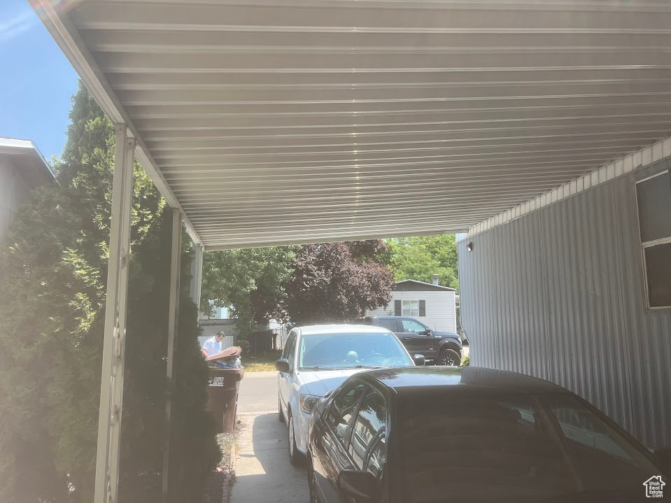 View of car parking featuring a carport