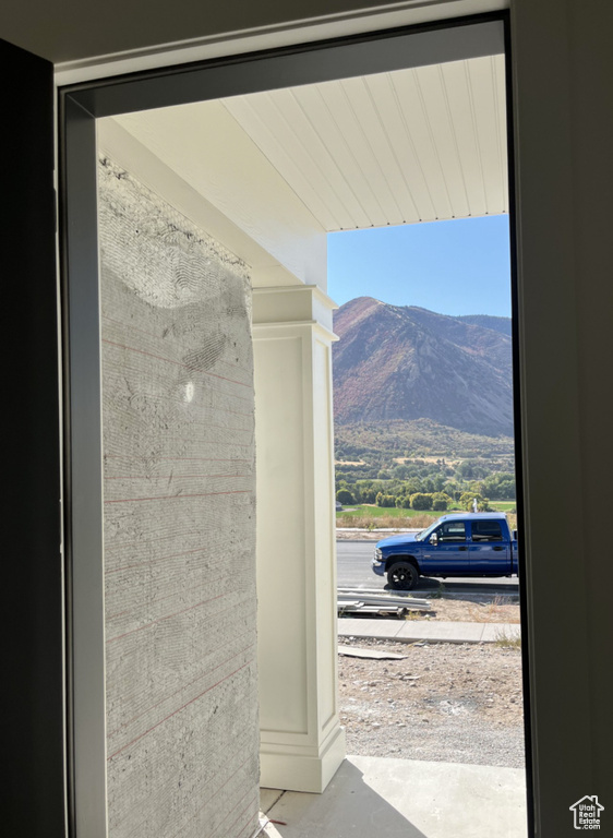 Entryway featuring concrete floors and a mountain view