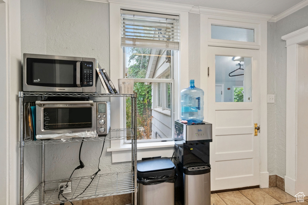 Interior space featuring ornamental molding and plenty of natural light