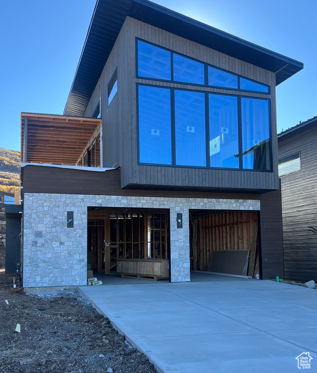 View of front of property featuring a garage