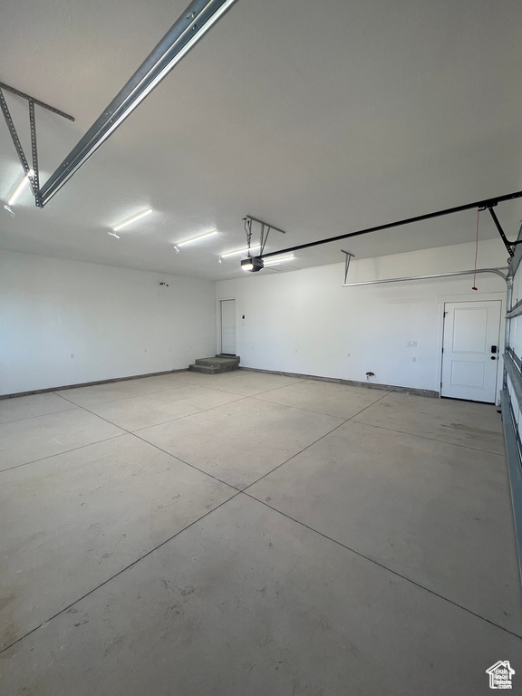 Garage featuring a garage door opener