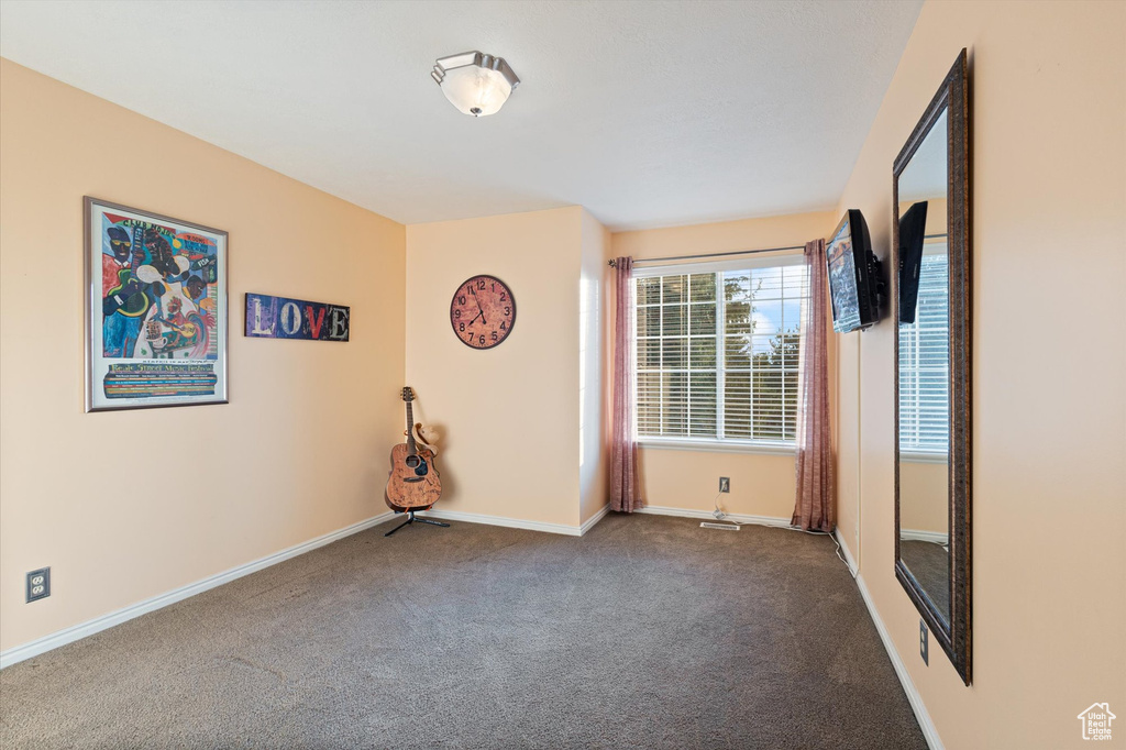 Spare room featuring carpet floors