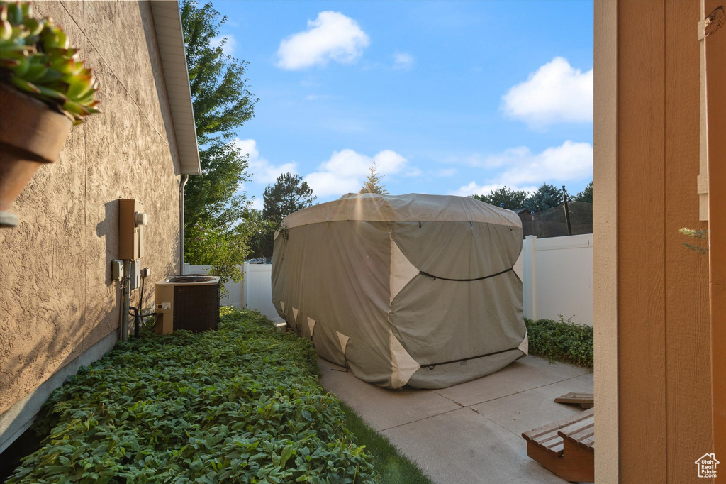 View of yard with a patio and central AC