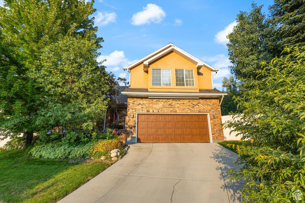 Front of property with a garage