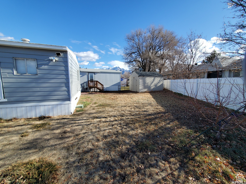 View of yard featuring a storage shed