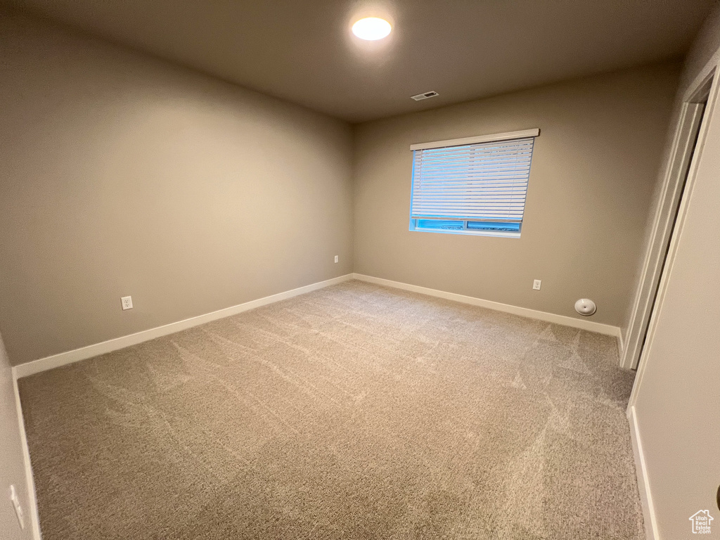 View of carpeted spare room