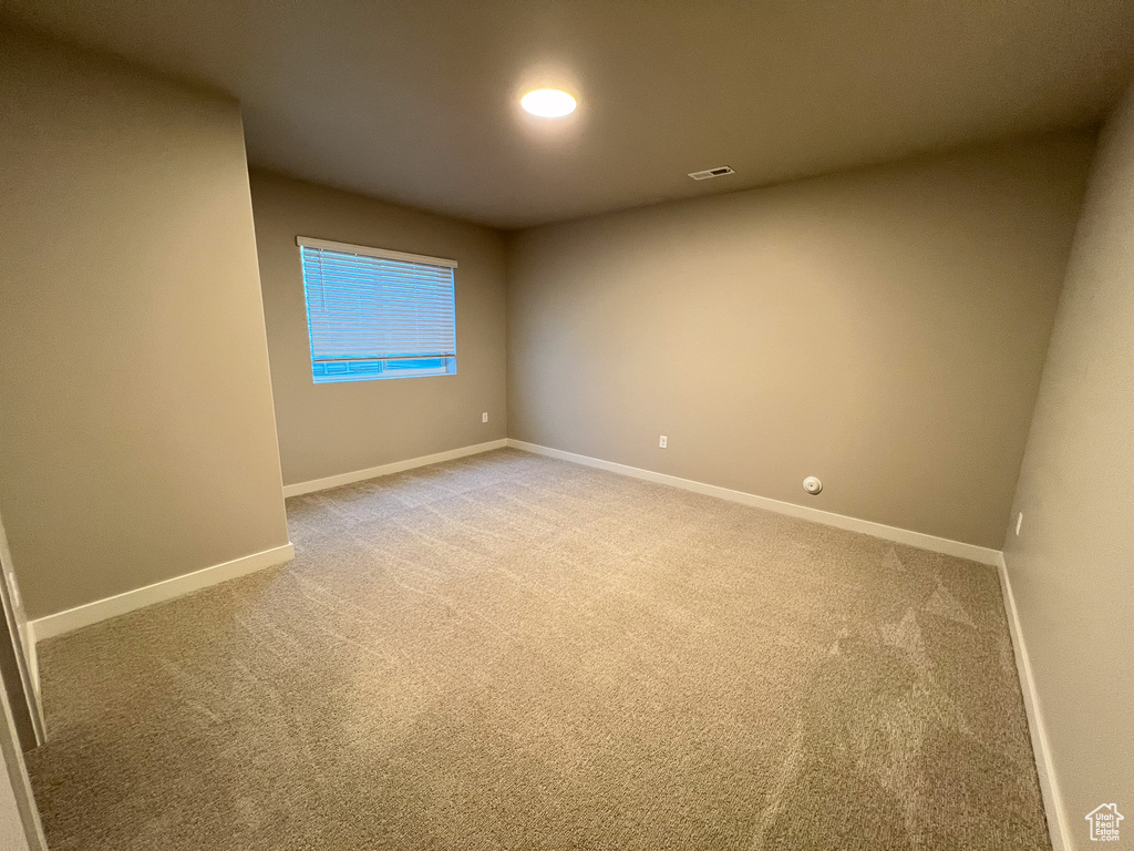 Spare room with light carpet