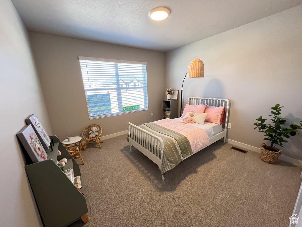 Bedroom with carpet flooring