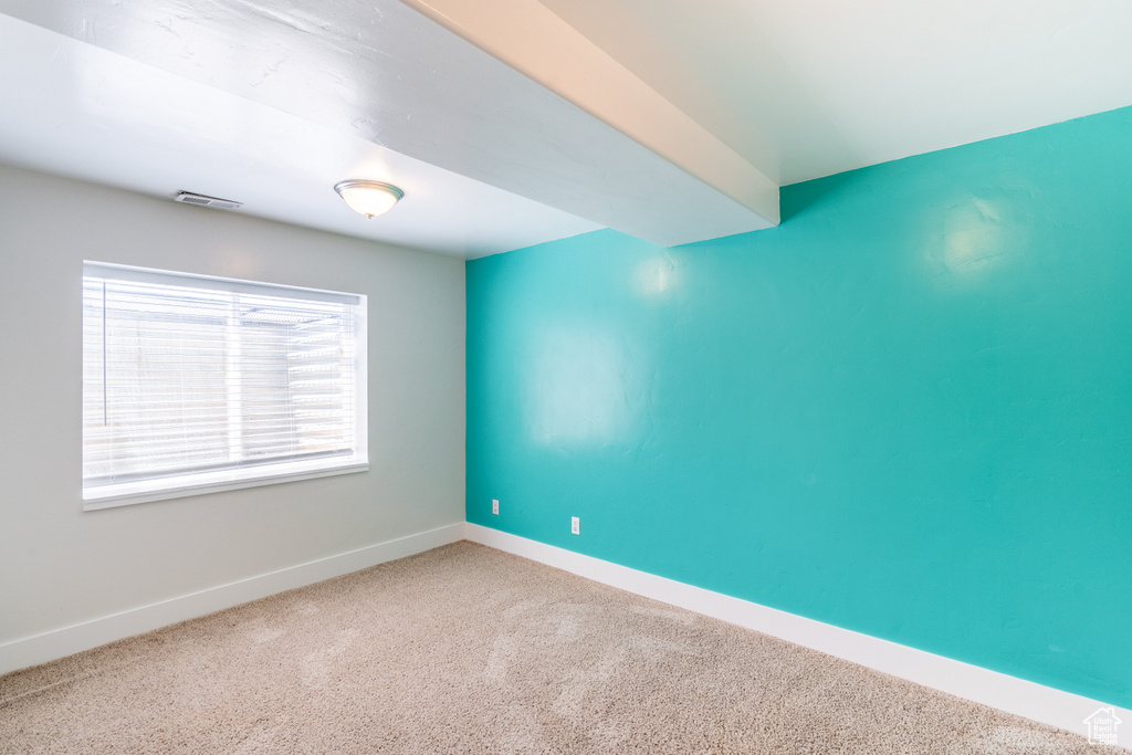 Empty room featuring carpet floors