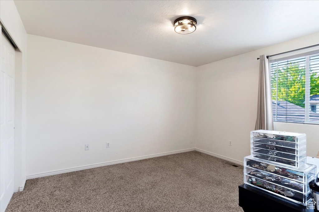 View of carpeted spare room