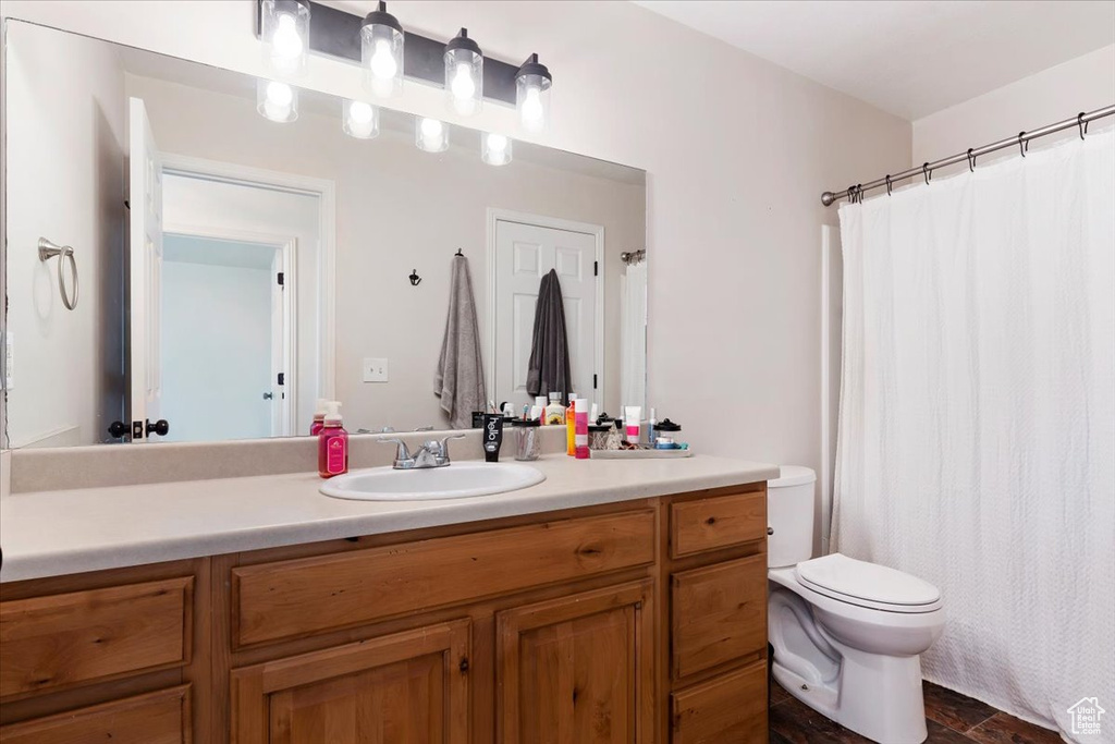 Bathroom featuring vanity and toilet