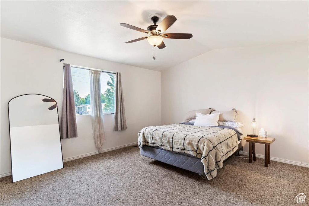 Bedroom with carpet, lofted ceiling, and ceiling fan