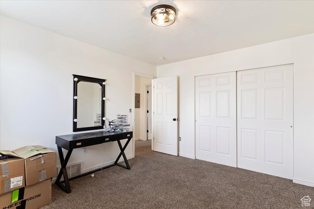 Miscellaneous room featuring dark carpet