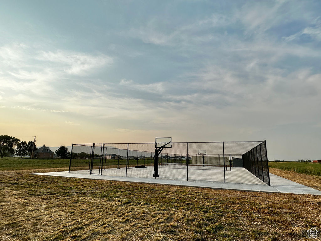 View of property\'s community with a yard and basketball hoop