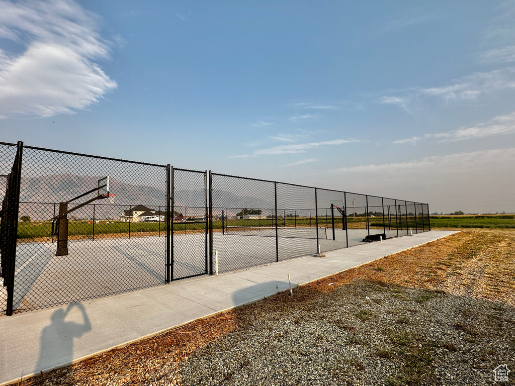 View of home\'s community featuring basketball court