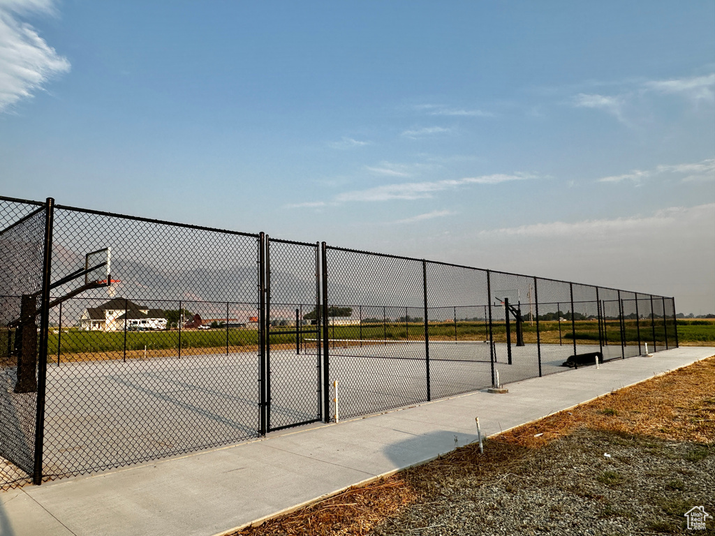 View of sport court featuring basketball hoop