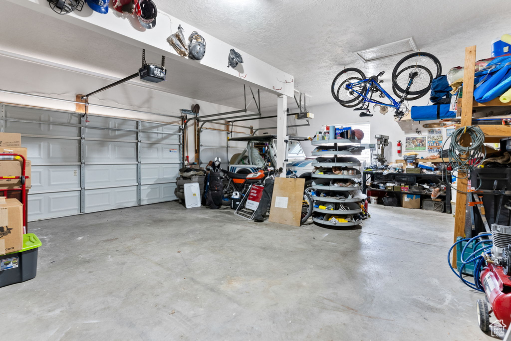 Garage featuring a garage door opener