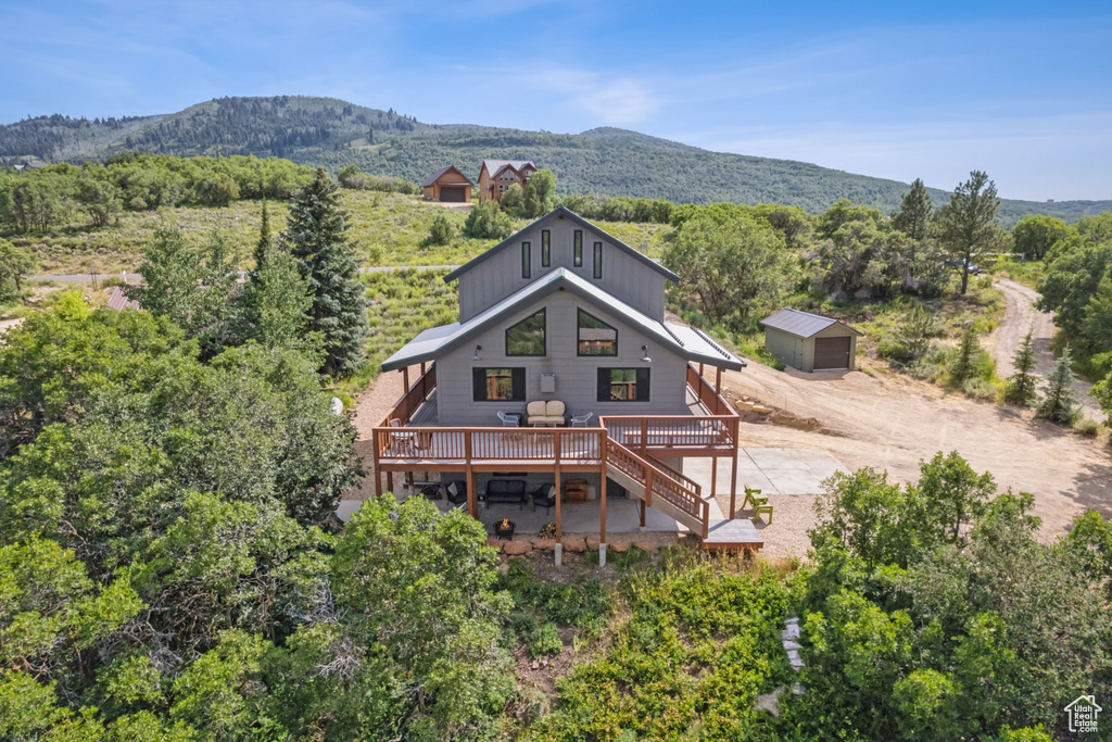 Birds eye view of property with a mountain view