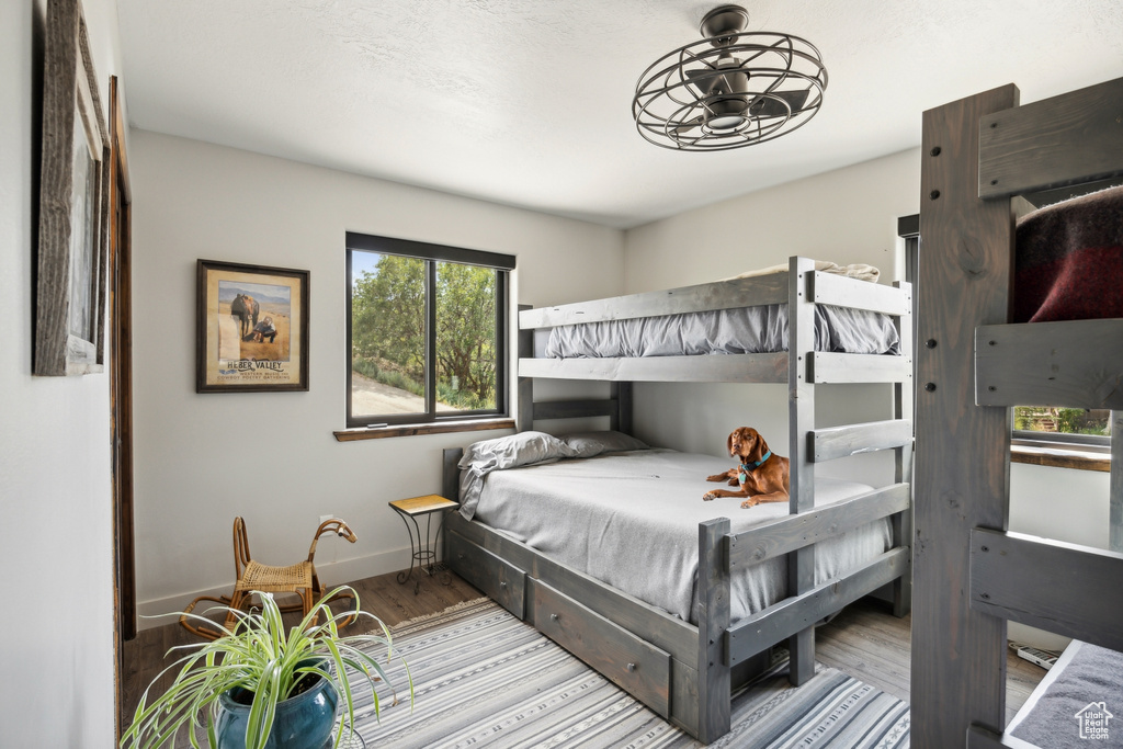 Bedroom with light hardwood / wood-style floors