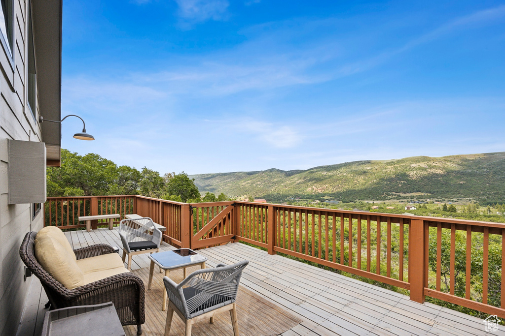 Wooden terrace with a mountain view and outdoor lounge area