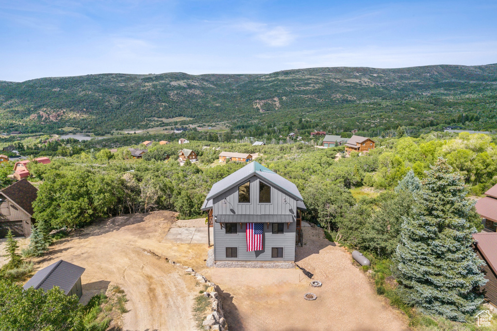 Birds eye view of property with a mountain view