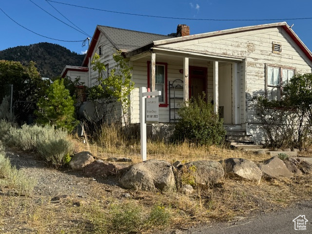 View of front of home featuring a mountain view