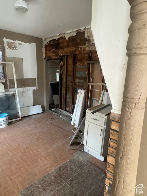 Misc room featuring parquet flooring and radiator