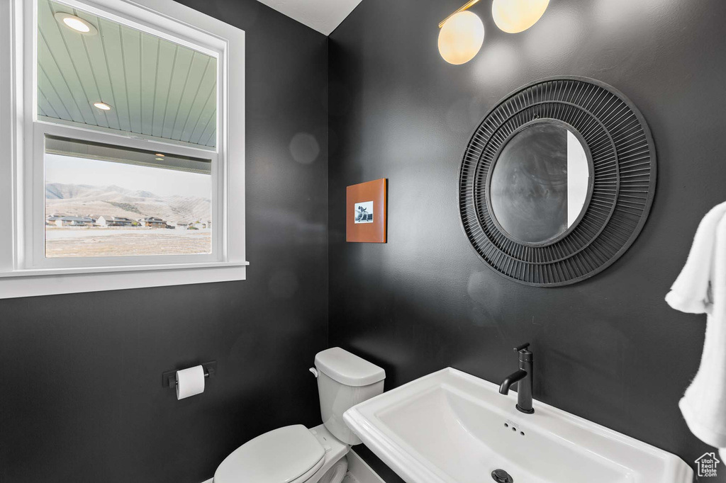 Bathroom featuring sink and toilet