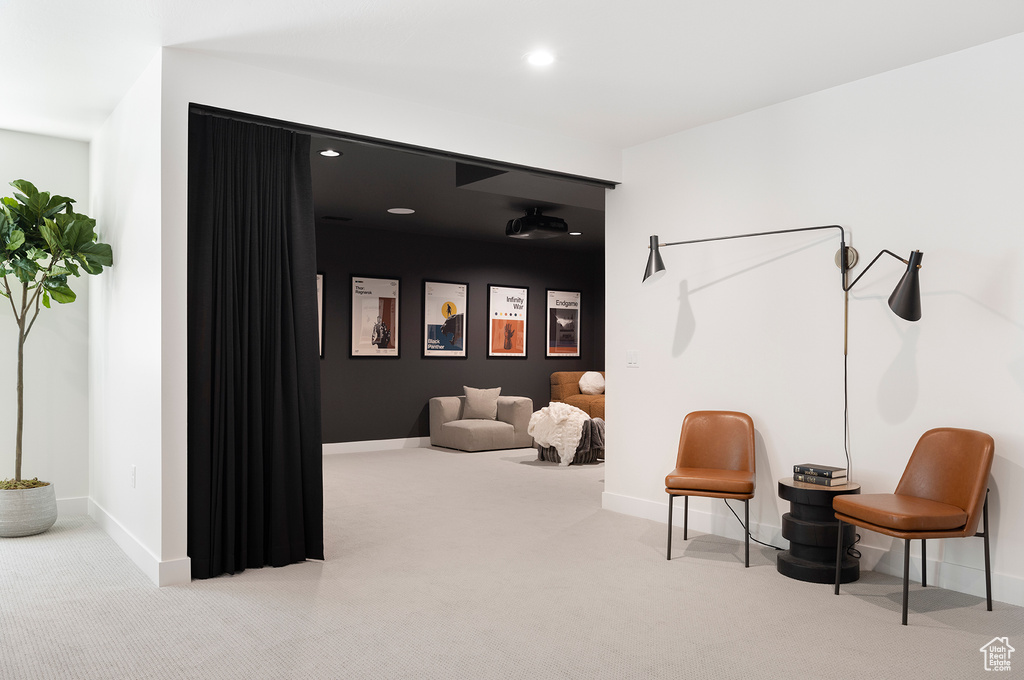 Sitting room featuring carpet floors