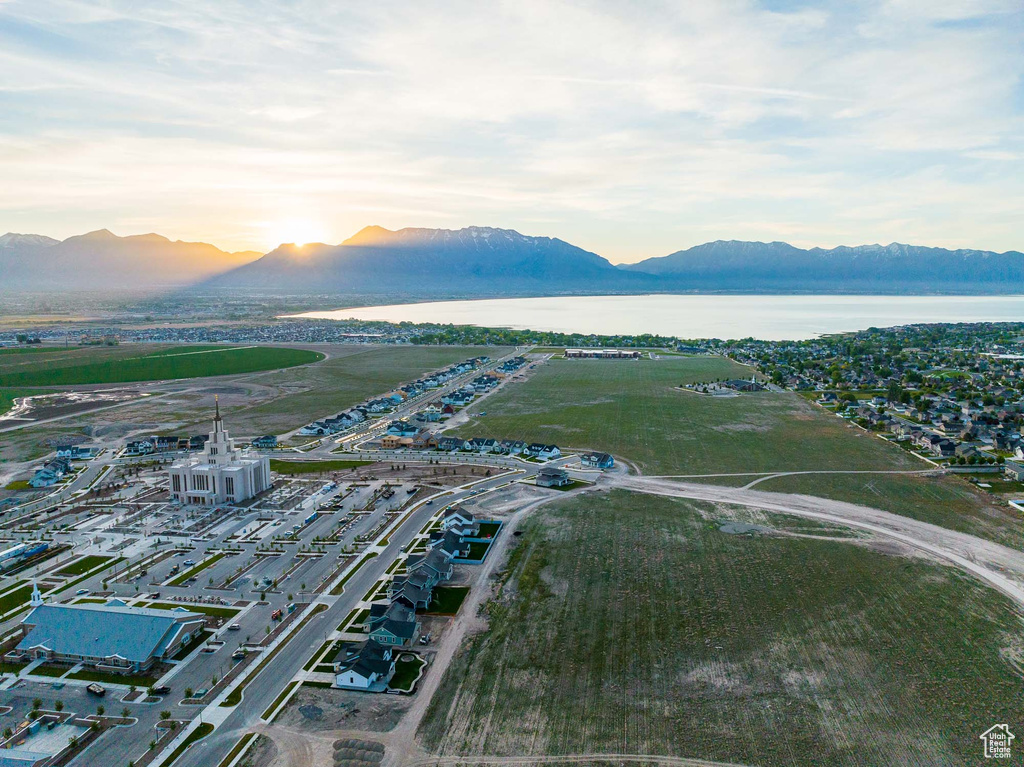 Aerial view at dusk with a water and mountain view