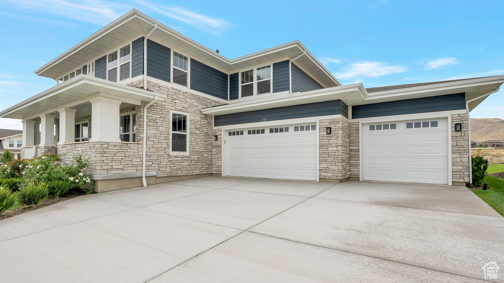 View of front of property with a garage