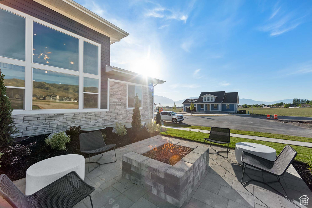 View of terrace with an outdoor fire pit