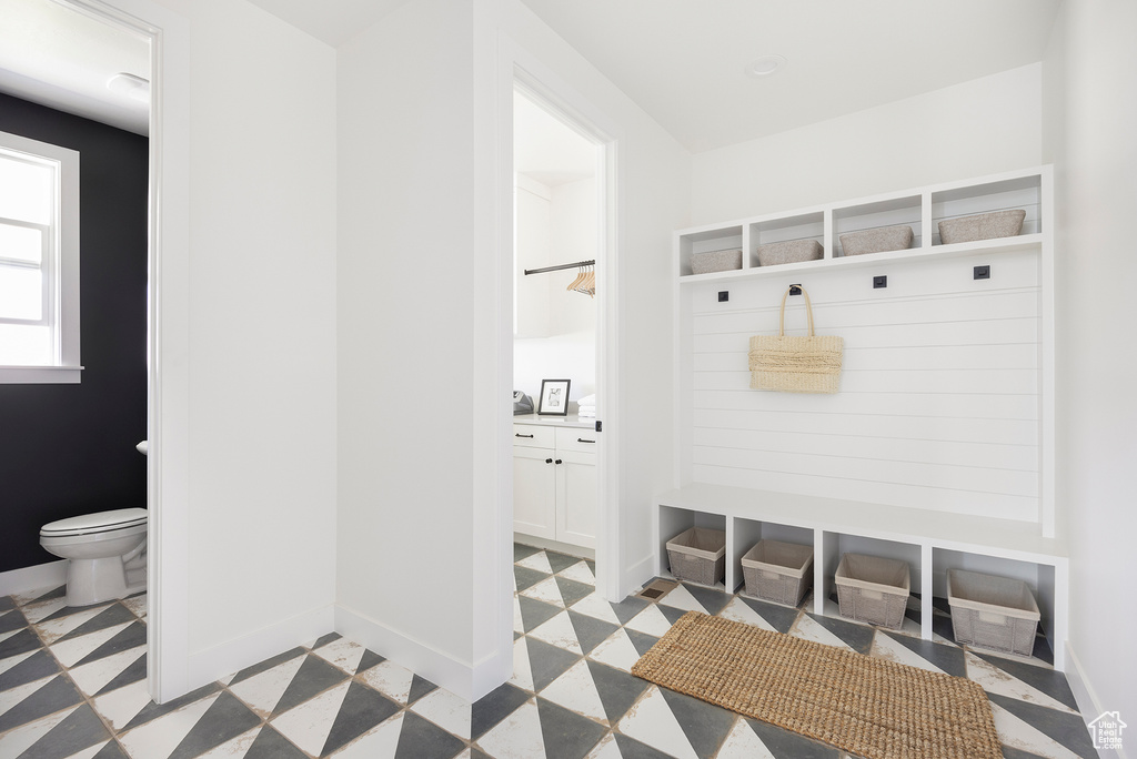 Mudroom with light tile floors