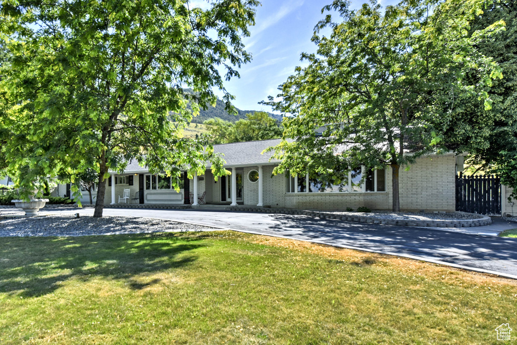 View of front of property featuring a front lawn