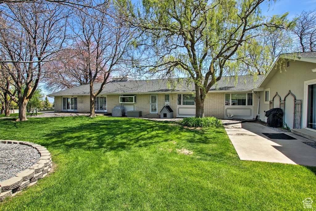 Exterior space featuring a yard