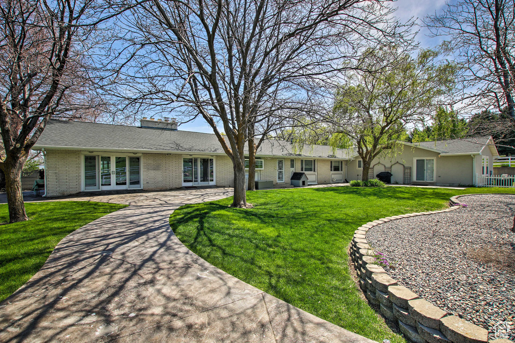 Single story home featuring a front yard