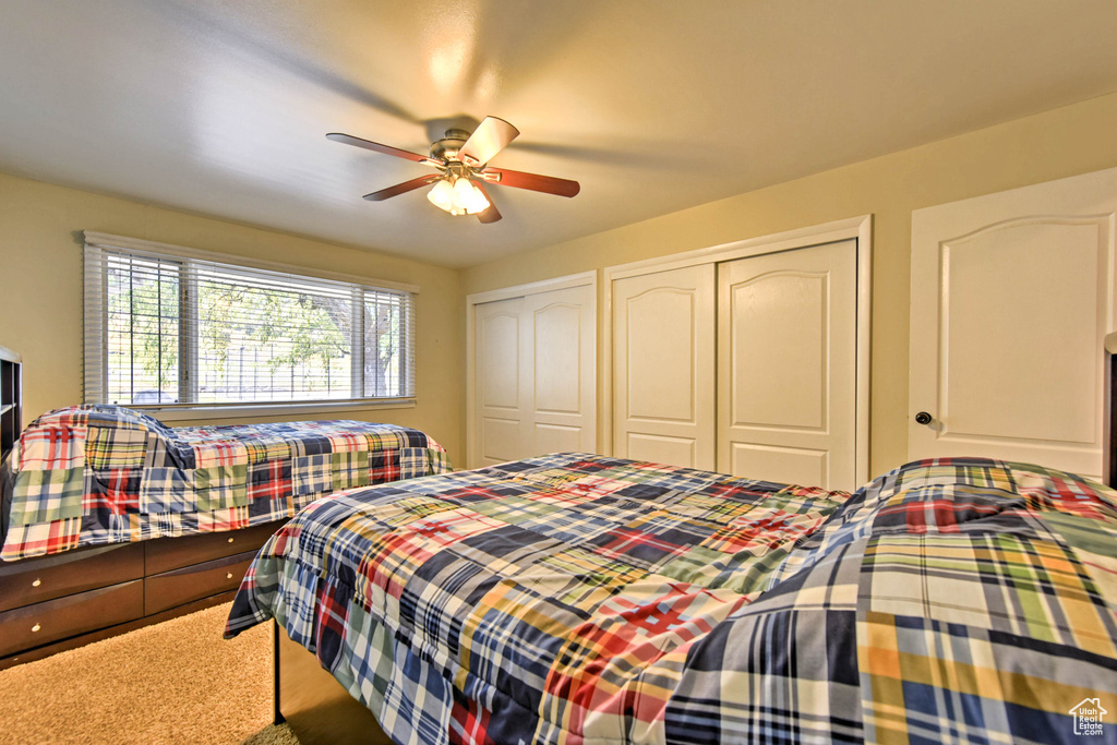 Bedroom featuring carpet floors and ceiling fan