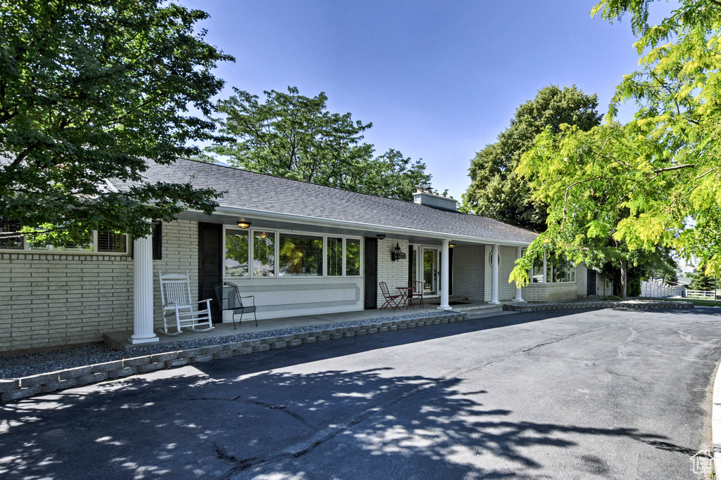 Single story home with a porch