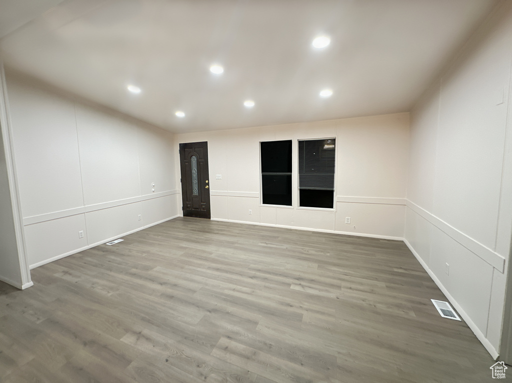 Empty room featuring hardwood / wood-style flooring